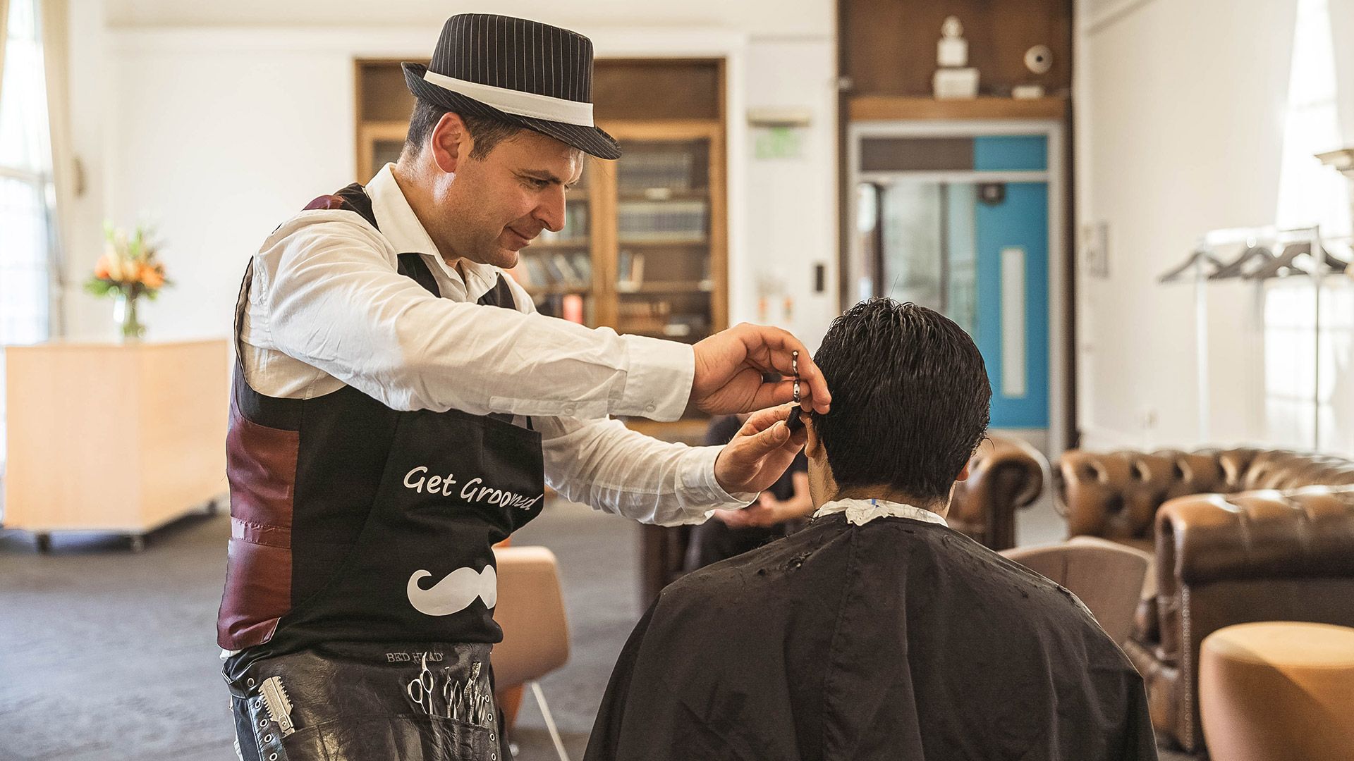 Professional barber providing grooming services